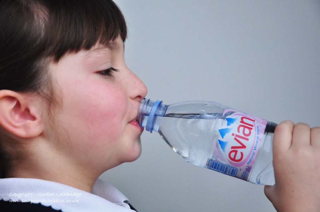 Girl drinking Evian