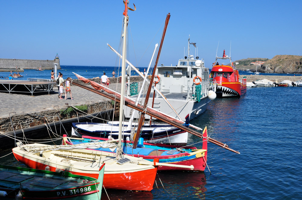 Boats tied up alongside the quay in Collioure harbour